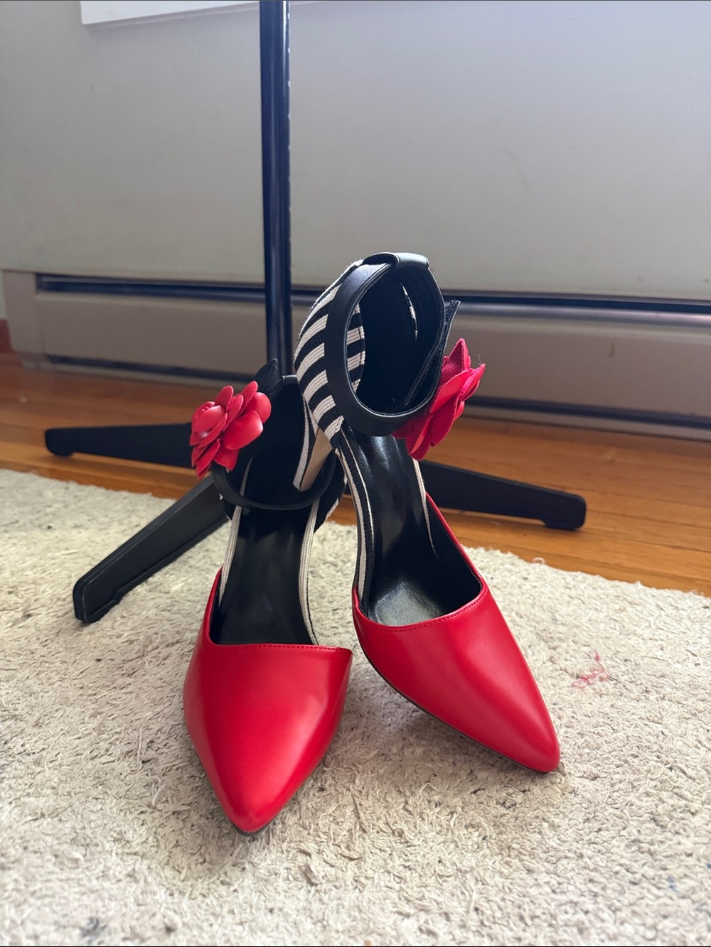 Red Pointed-Toe Heels with Floral Accent and Striped Ankle Strap